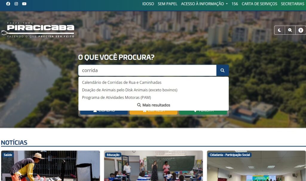 A imagem mostra a página inicial do site da Prefeitura de Piracicaba. O topo exibe o logotipo da prefeitura e links para diversas seções, como "idoso", "sem papel", "acesso à informação", etc. Há uma barra de busca onde "corrida" foi digitado, resultando em sugestões como "Calendário de Corridas de Rua e Caminhadas", "Doação de Animais", e "Programa de Atividades Motoras". Abaixo, a seção "Notícias" apresenta imagens e títulos relacionados a saúde, educação e cidadania/participação social. A página é predominantemente em português e apresenta uma interface limpa e organizada.