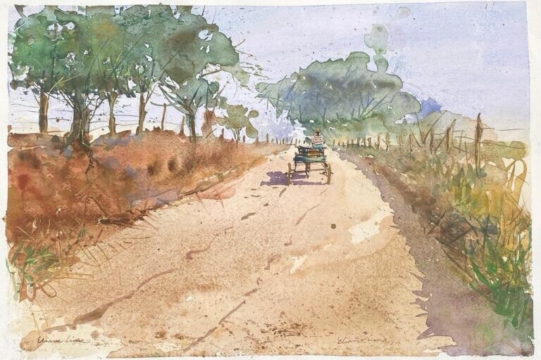 A imagem é uma pintura em aquarela que retrata uma cena rural tranquila. No centro da composição, há uma carroça puxada por um cavalo, vista de costas, seguindo por uma estrada de terra que se estende em direção ao horizonte. A carroça tem quatro rodas e é conduzida por uma pessoa vestindo uma camisa listrada e um chapéu. Ao redor da estrada, há cercas de madeira e vegetação rasteira, com árvores à esquerda e arbustos ou capim alto à direita. O céu é claro, com tons suaves de azul e lilás, sugerindo um dia ensolarado. A técnica da aquarela é fluida e leve, com pinceladas soltas que dão um ar impressionista à cena. A assinatura "Eliane Lima" aparece no canto inferior esquerdo, indicando o nome da artista. A pintura transmite uma sensação de calma, simplicidade e conexão com a natureza.